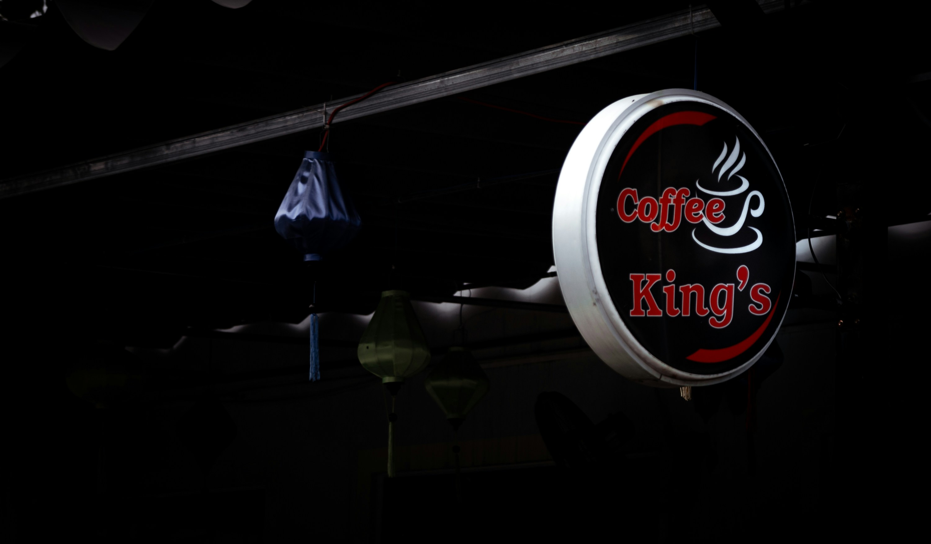 a sign hanging from the side of a building