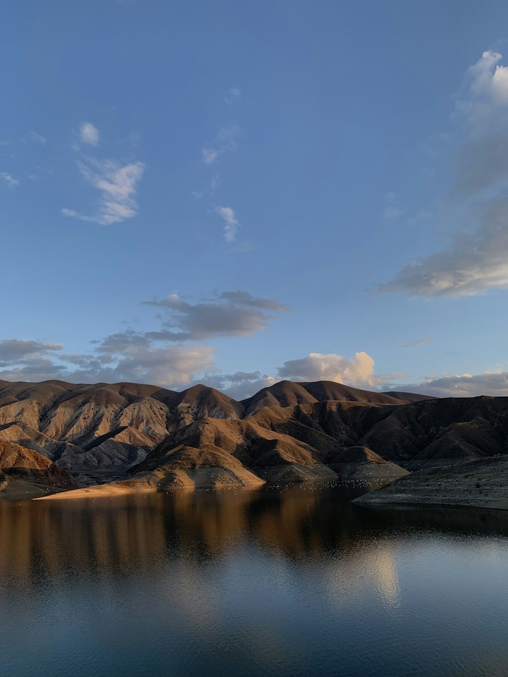 a large body of water surrounded by mountains