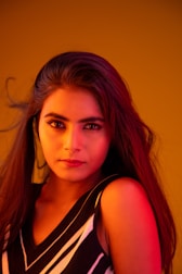a woman with long hair posing for a picture