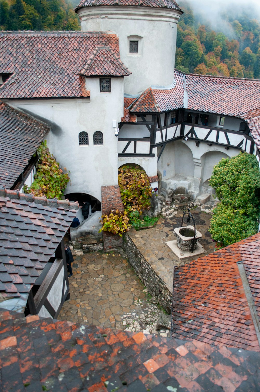 an aerial view of a building with a clock tower