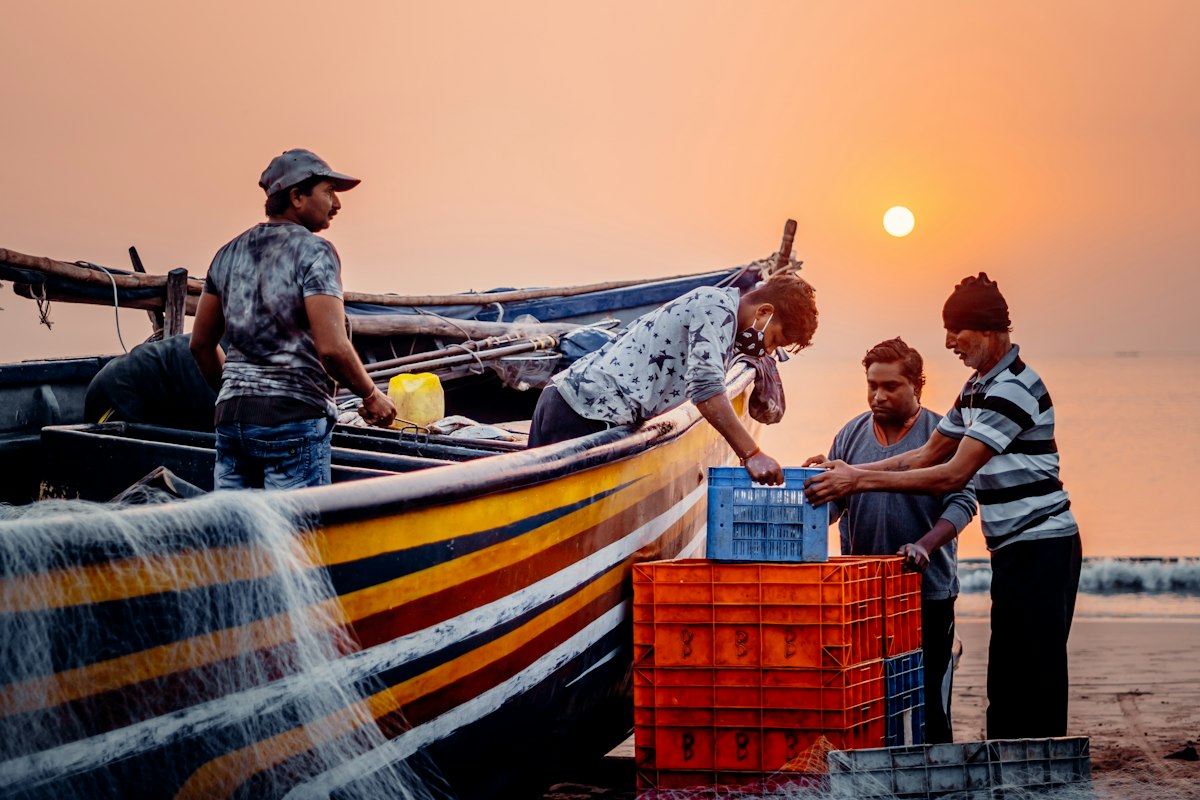 Fisherman working on a boat at sea