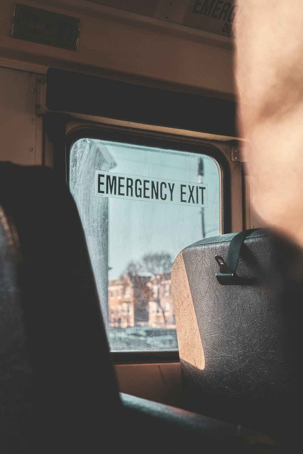 an emergency exit sign on the side of a train