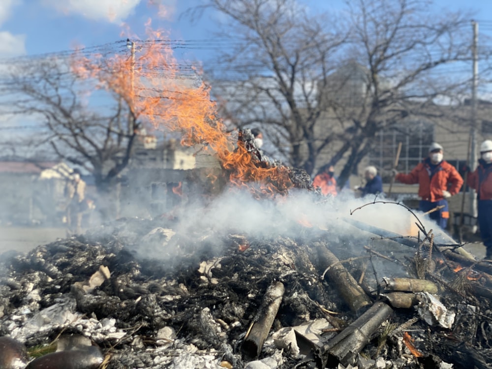 a fire is burning in the middle of a pile of debris