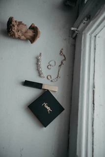 Flat lay of Lumina Apparel accessories arranged on a minimalist concrete surface