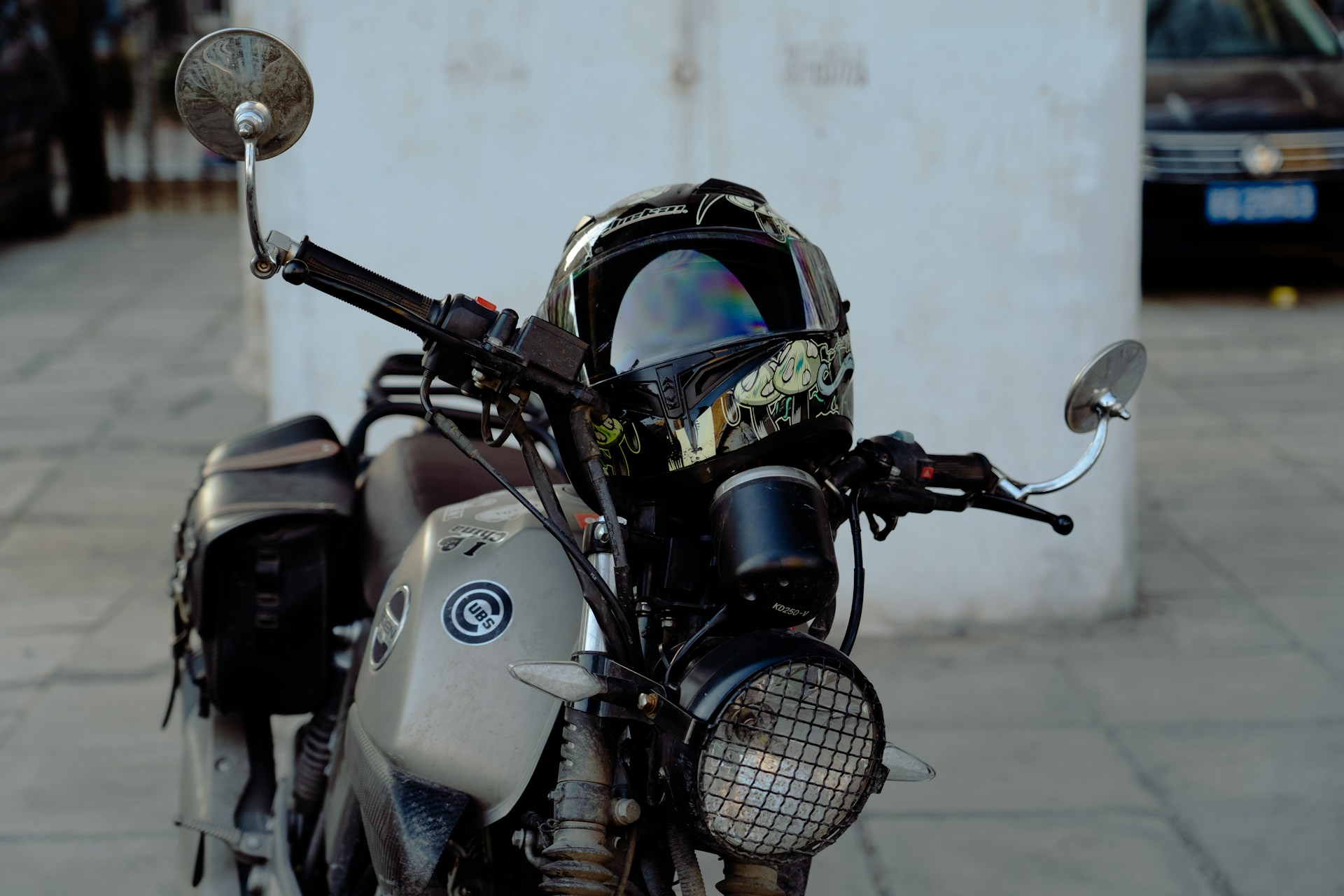 a motorcycle with a helmet on the back of it