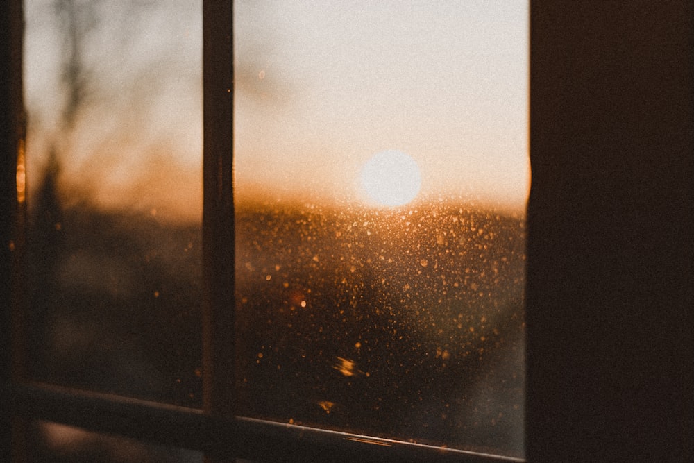 the sun is shining through the window of a house