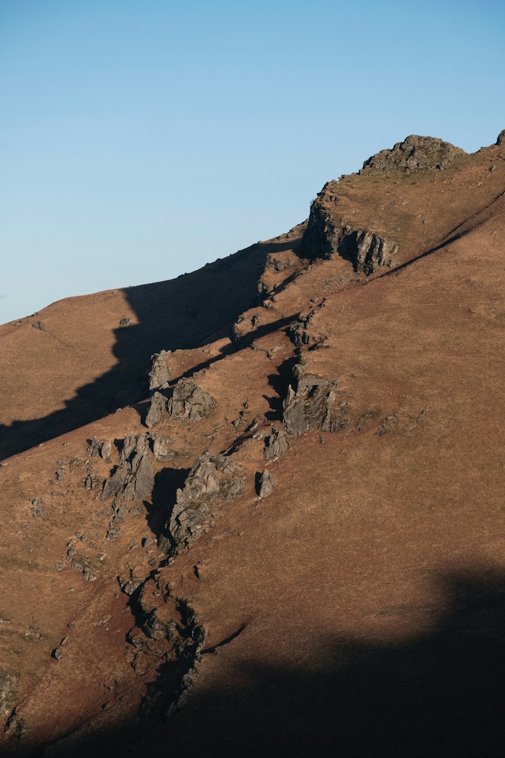 a man riding a horse on top of a hill