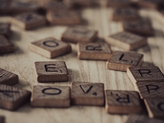 a close up of a scrabble of wooden letters