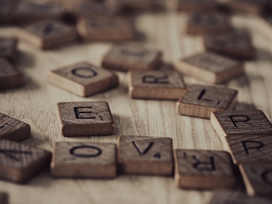 a close up of a scrabble of wooden letters