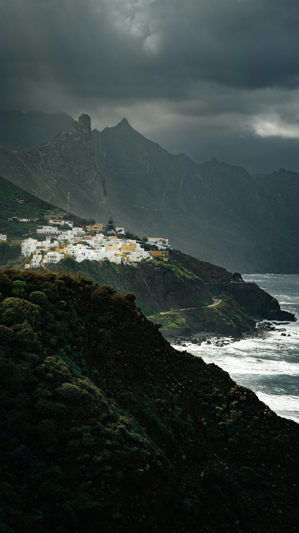 a scenic view of the ocean and mountains