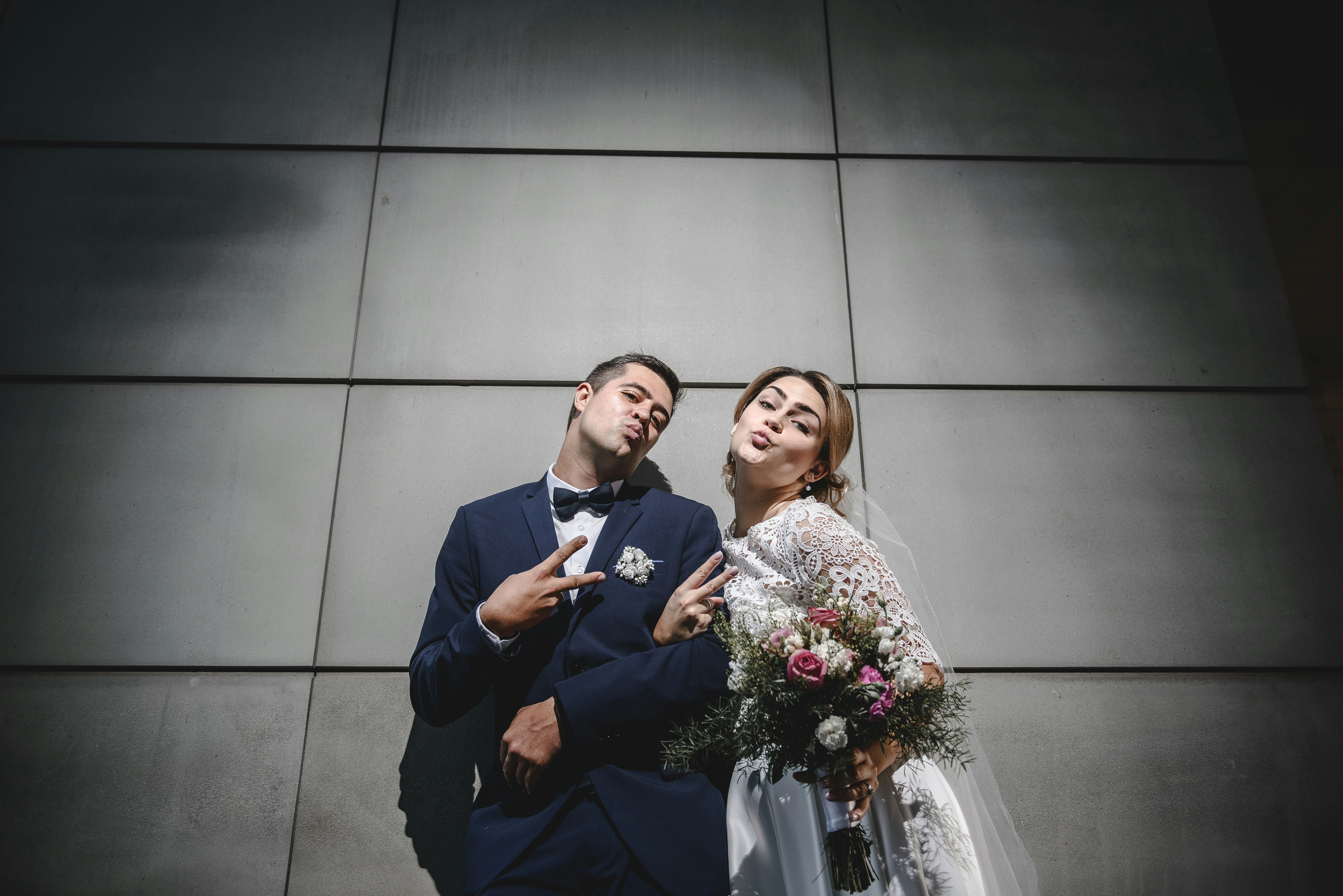 happy couple looking at beautiful wedding photos together
