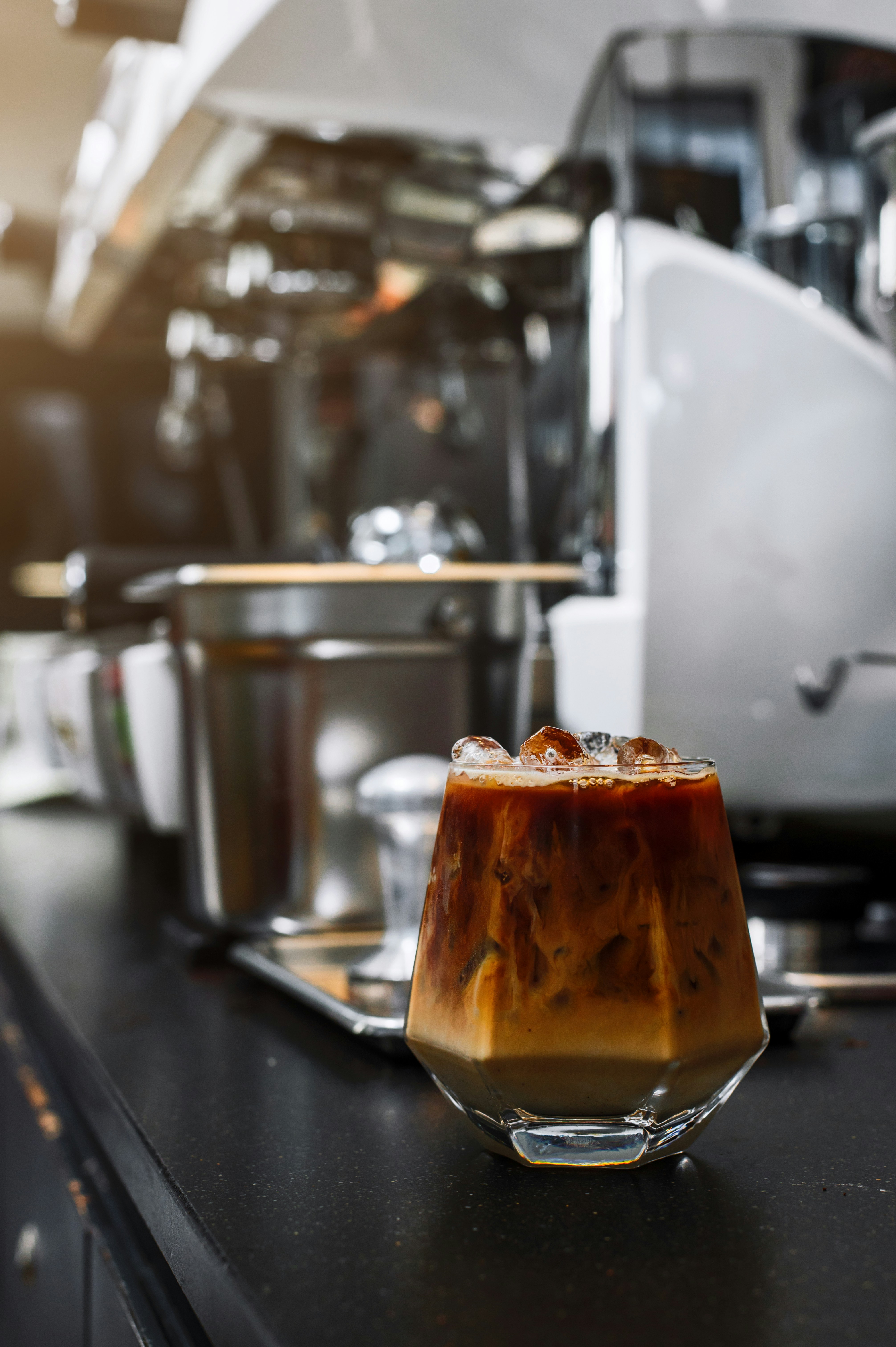 a cup of iced coffee sitting on a counter