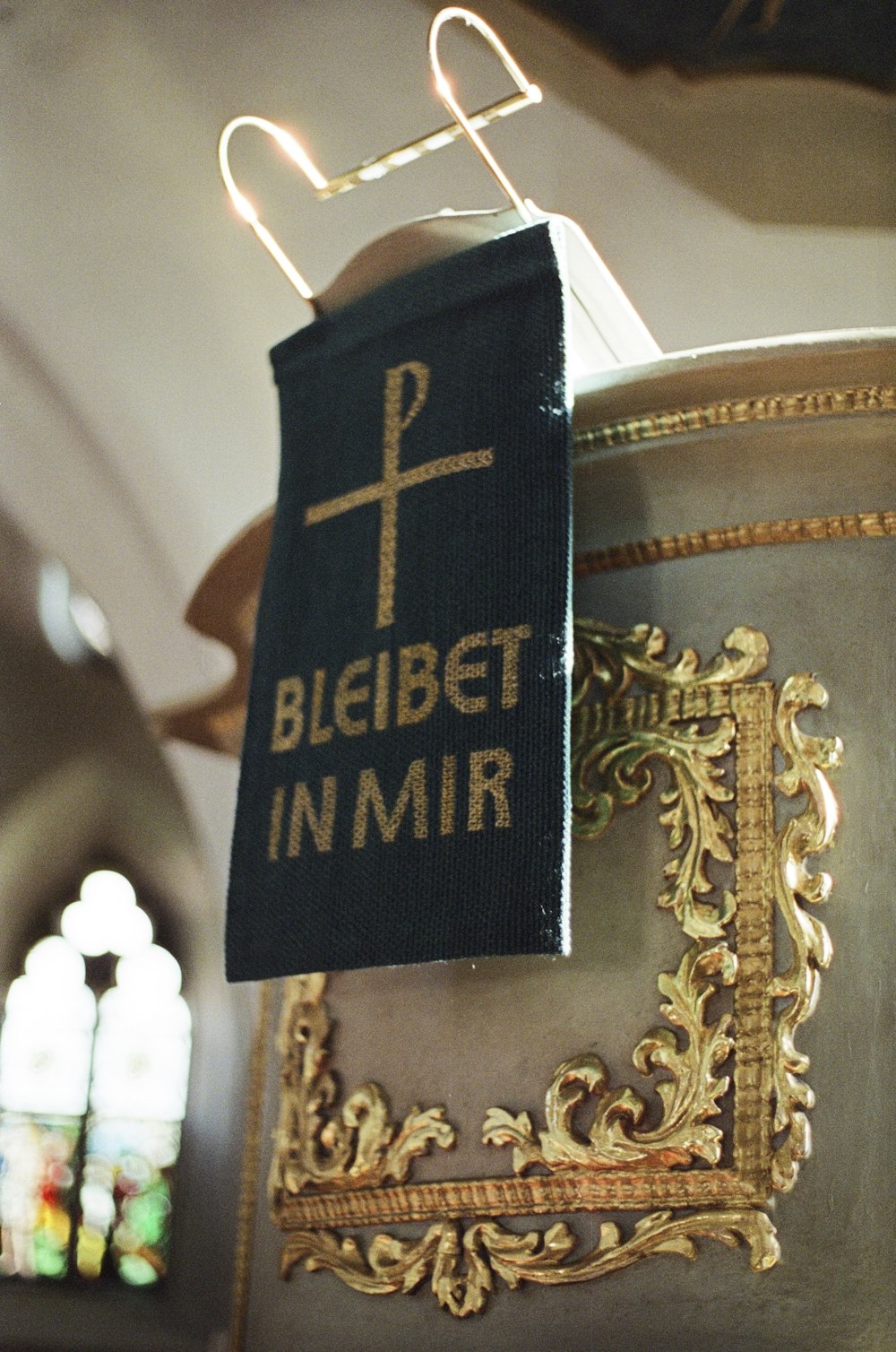 a cloth with a cross on it hanging from a hook