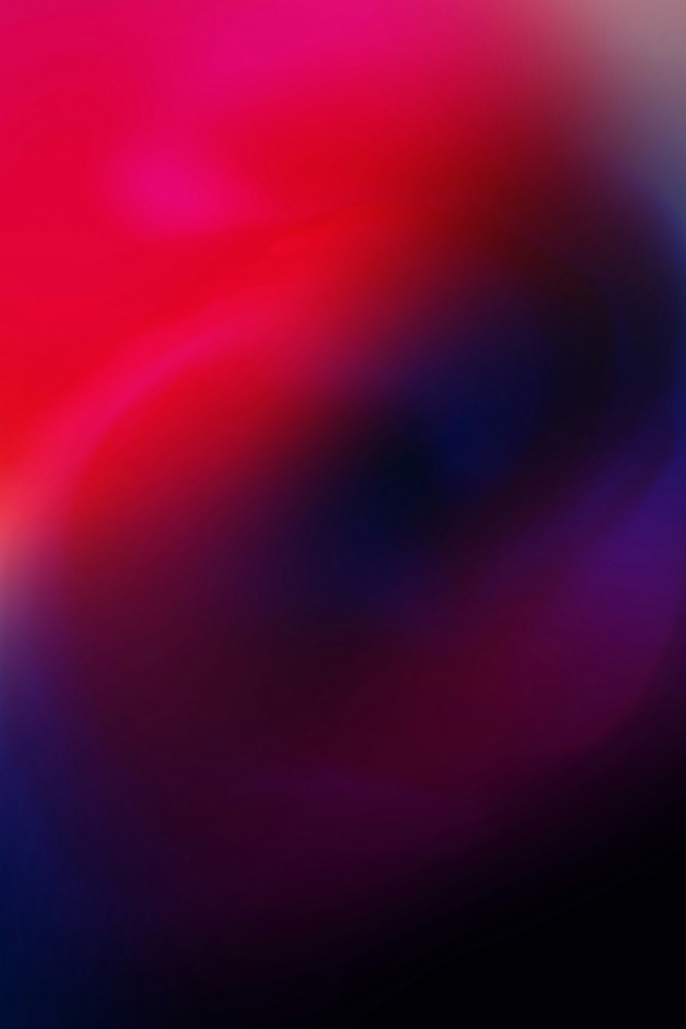 a blurry image of a pink and blue background