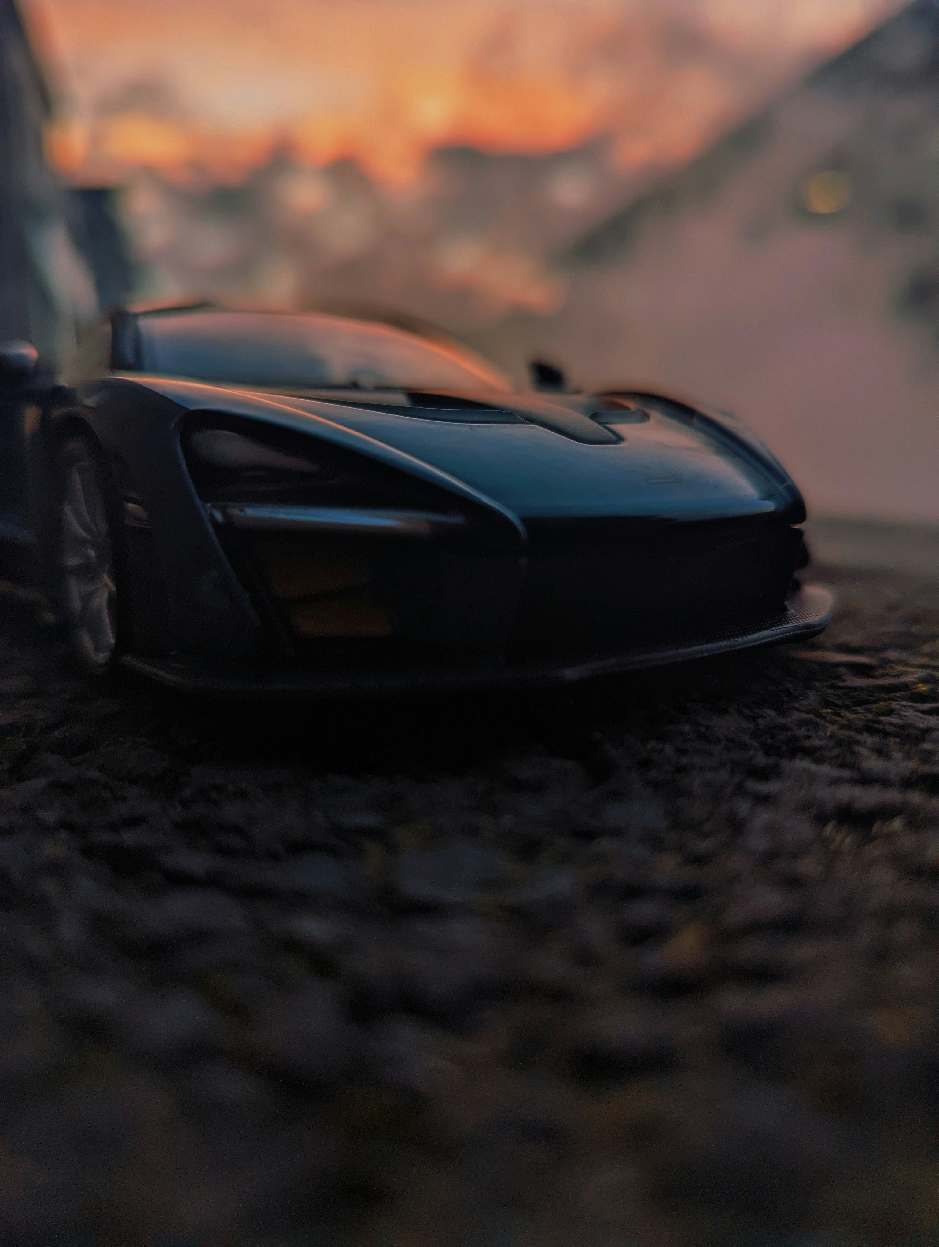 a toy car is sitting on the ground