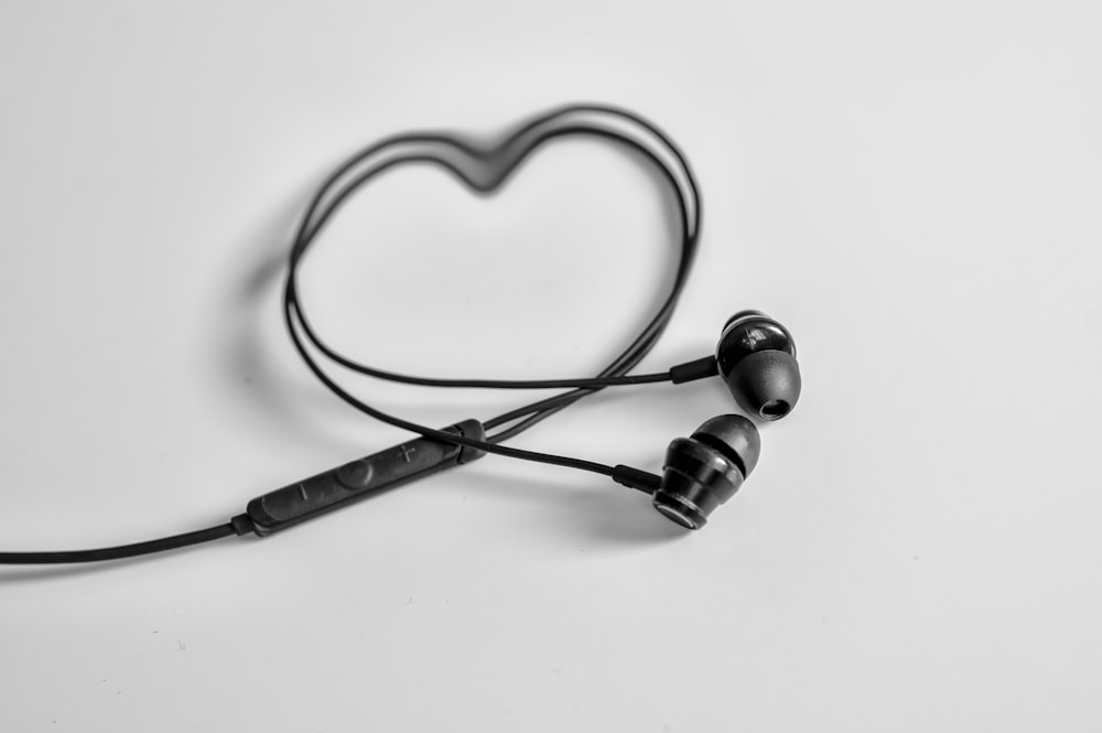 a pair of ear buds sitting on top of a table