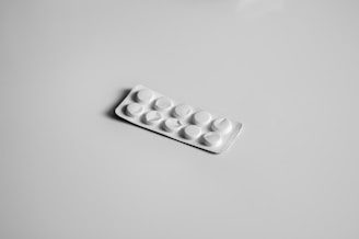 a white pill pill case sitting on top of a table