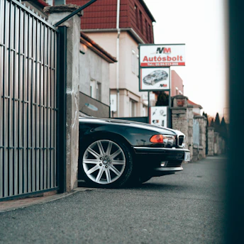 a black car parked in front of a building