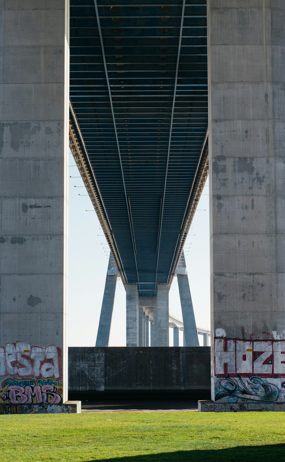 a bridge with graffiti on the side of it