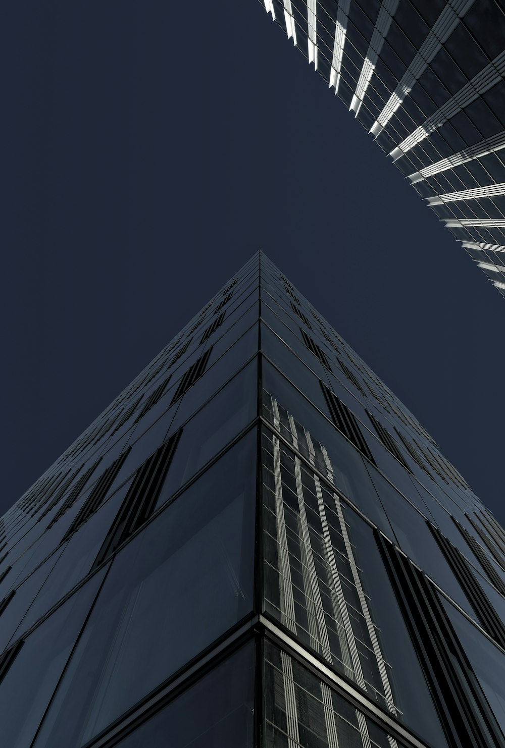 a very tall building with a sky background