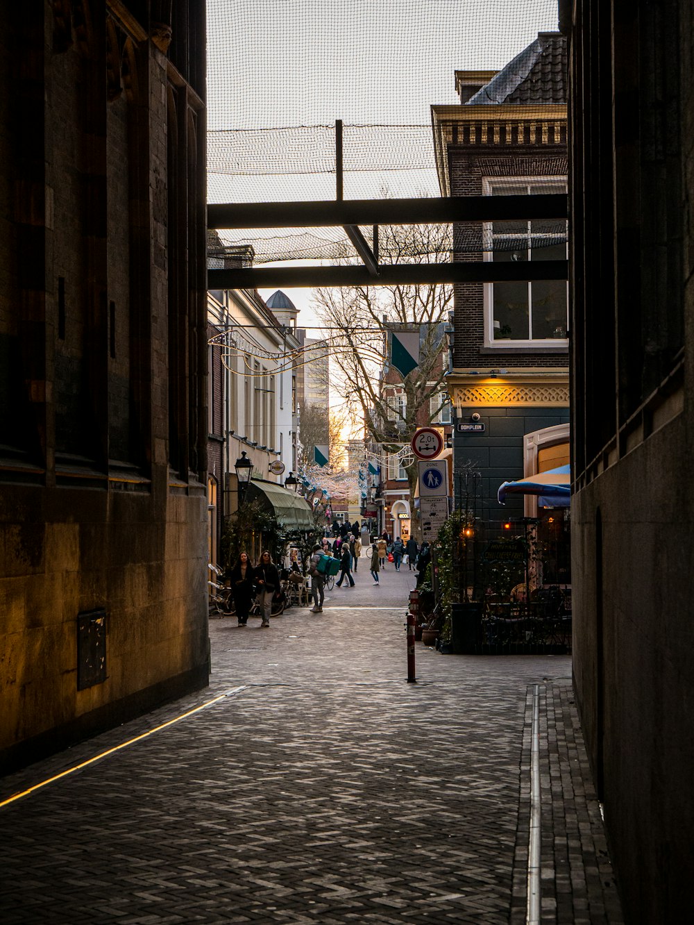 a city street with people walking down it