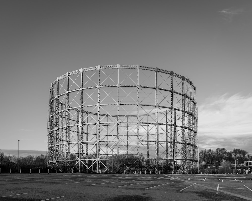 a large metal structure sitting on top of a parking lot