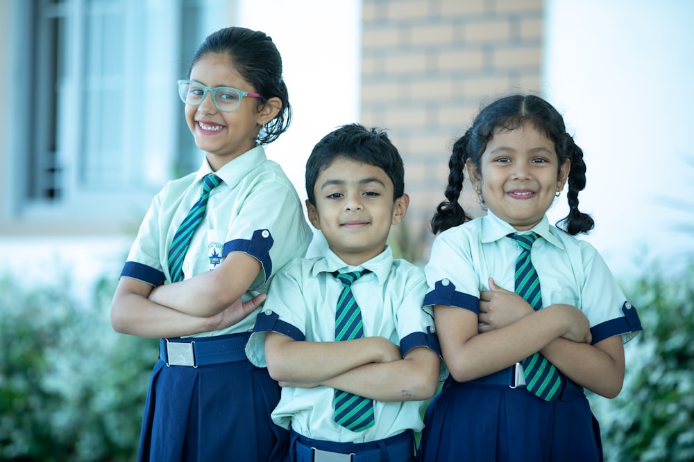 a group of young children standing next to each other