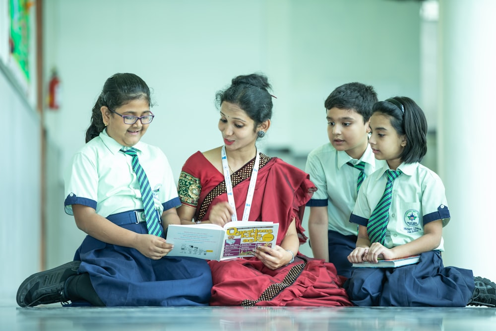 a group of young children sitting on the floor