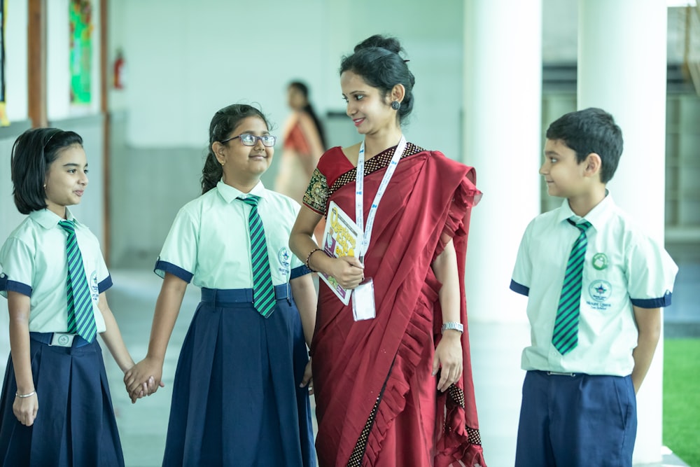 a group of young children standing next to each other