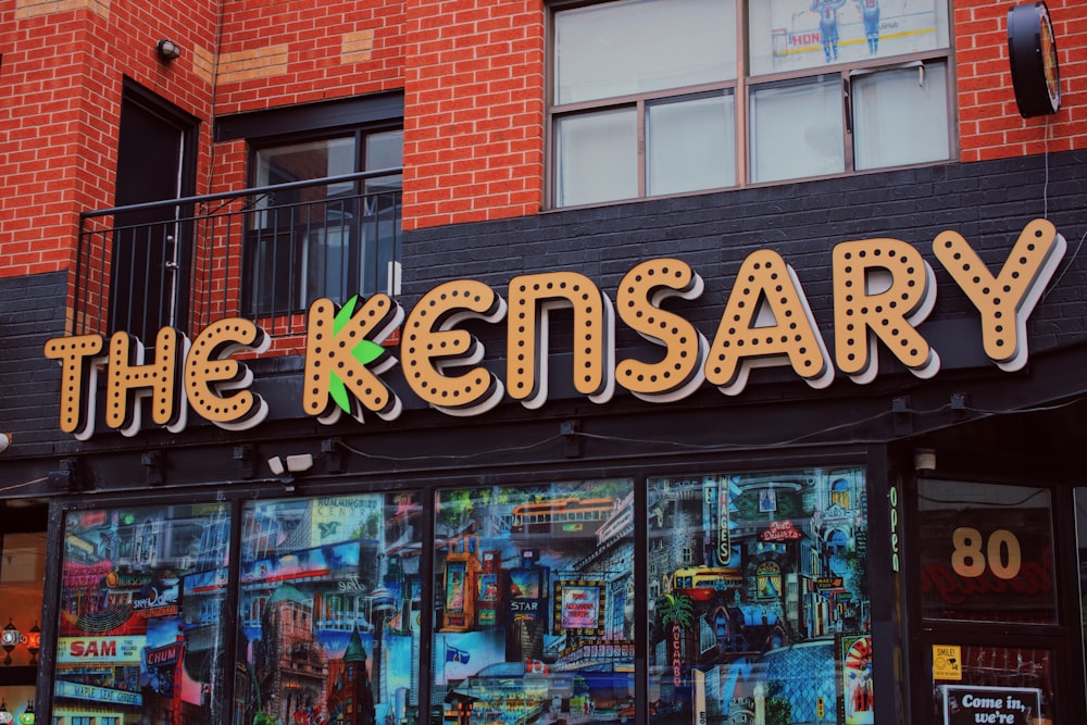 a store front with a large neon sign above it