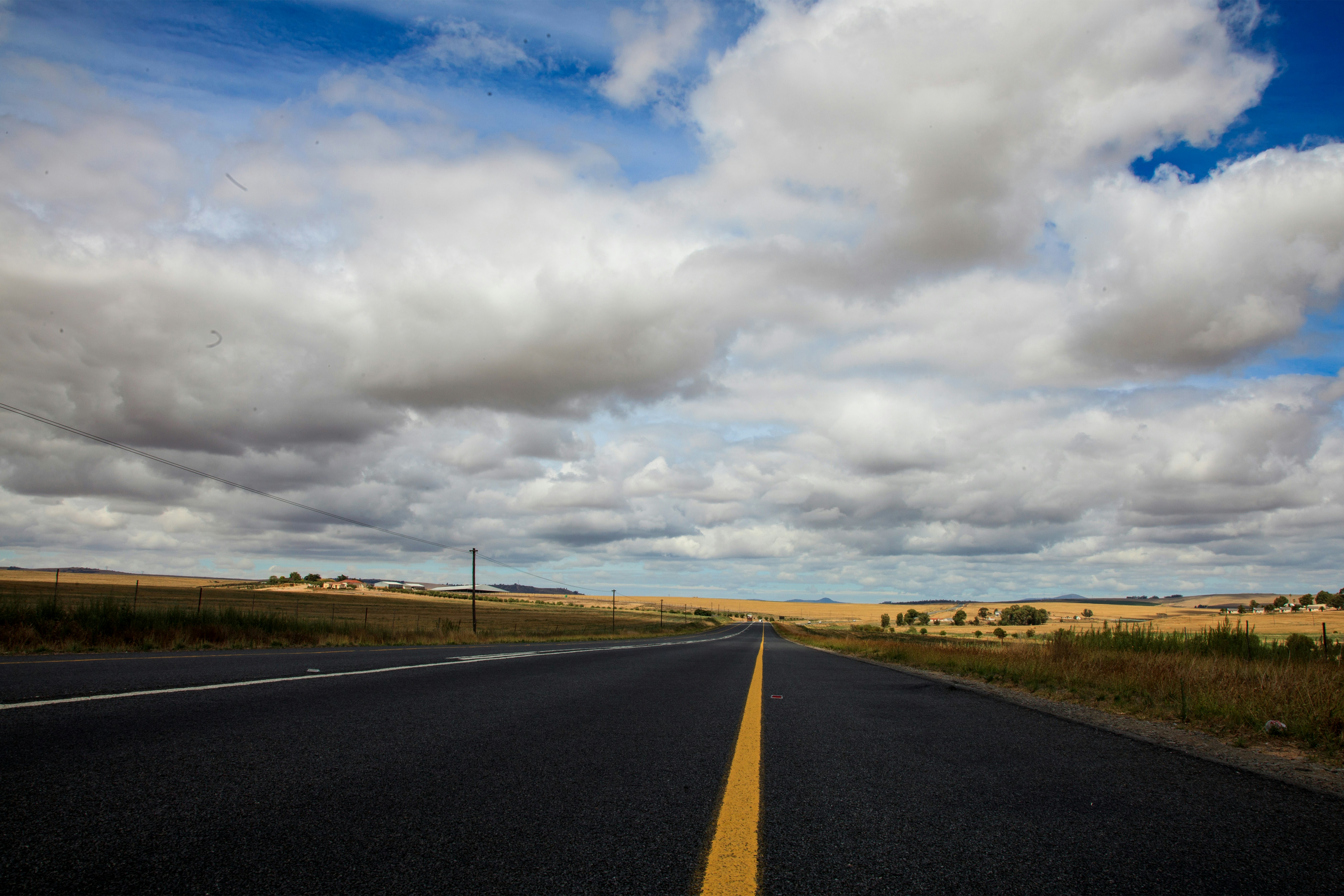 a road with a yellow line in the middle of it