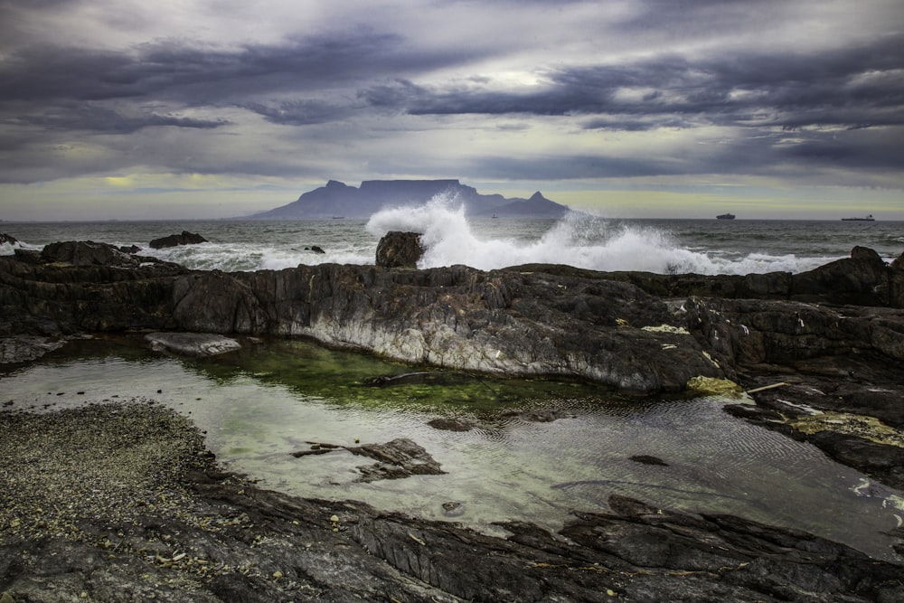 a large body of water surrounded by rocks