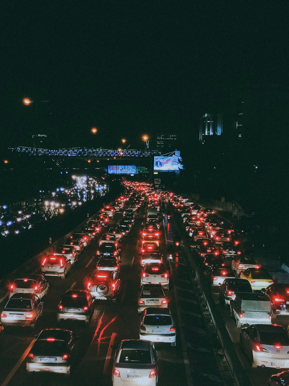 a highway filled with lots of traffic at night