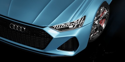 a close up of the front of a blue car