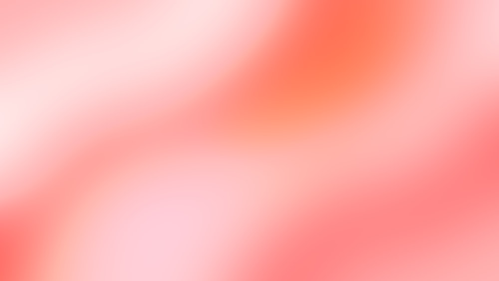 a blurry image of an orange and pink background