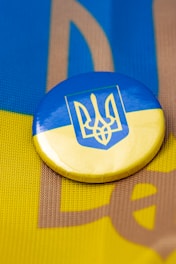 a button with a coat of arms on it