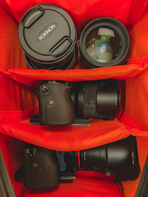 Professional photographer packing camera gear into the spacious, organized interior.