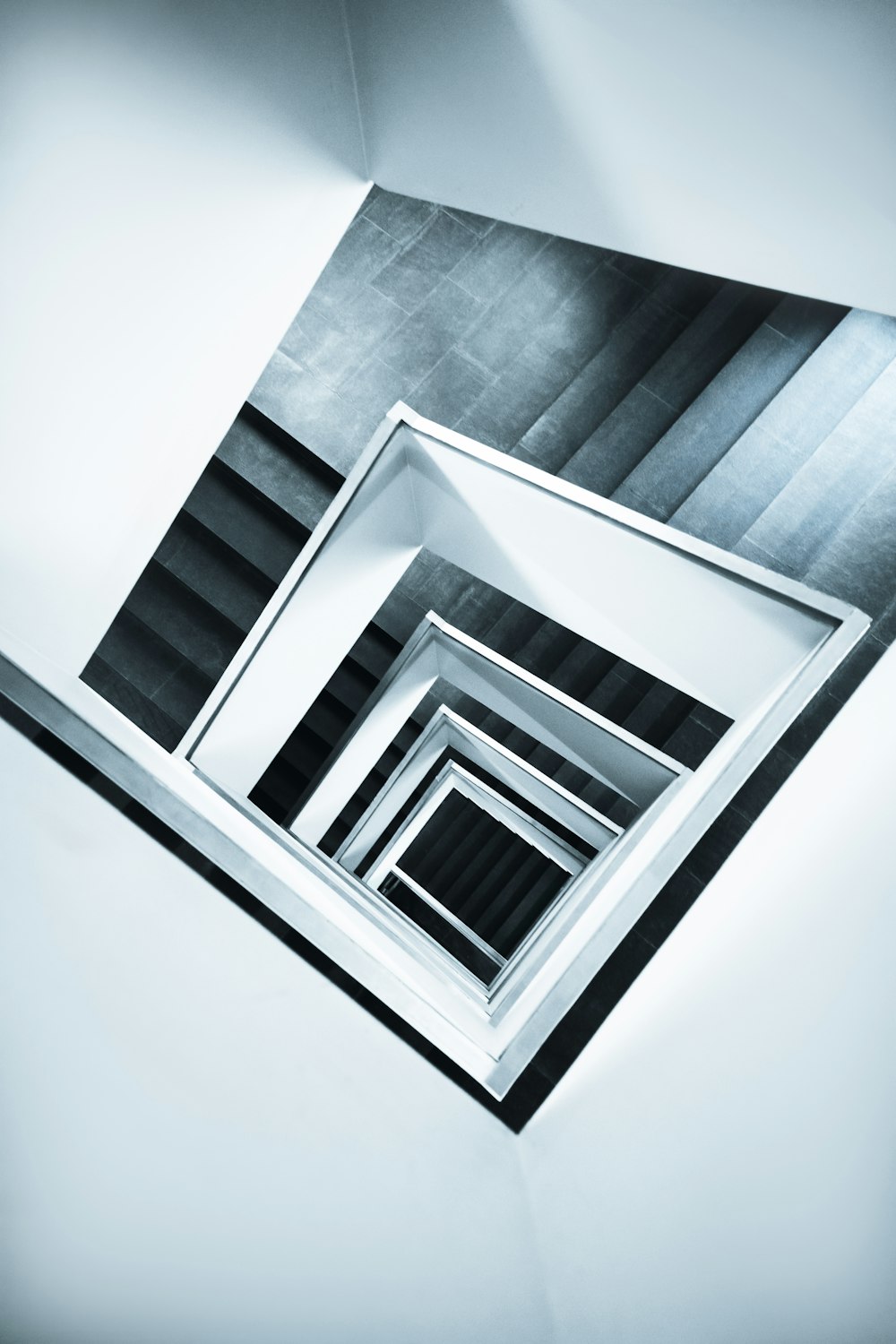 a black and white photo of a staircase