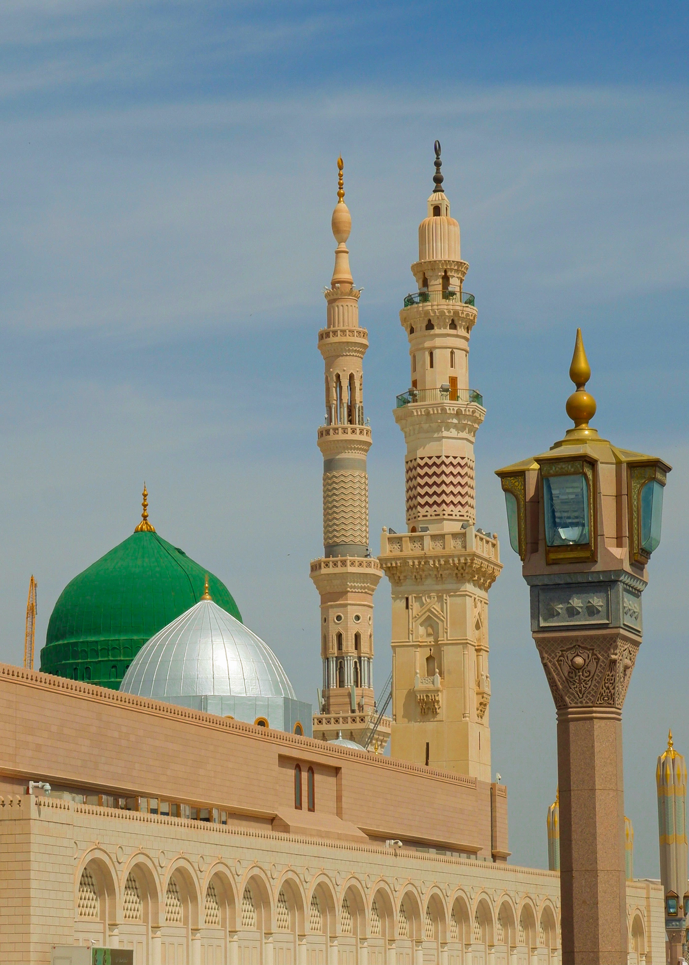 Masjid an-Nabawi in Madinah with its Green Dome and illuminated minarets