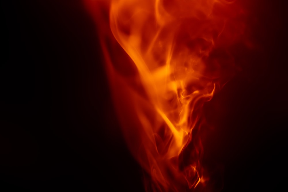 a close up of a fire on a black background