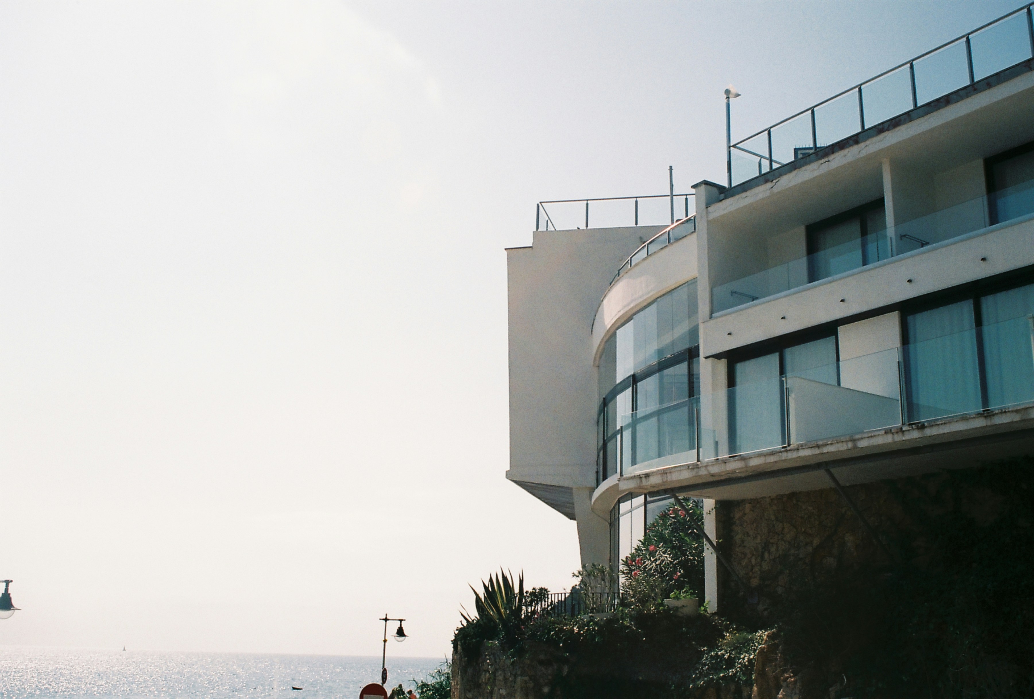 a view of the ocean from a balcony of a building