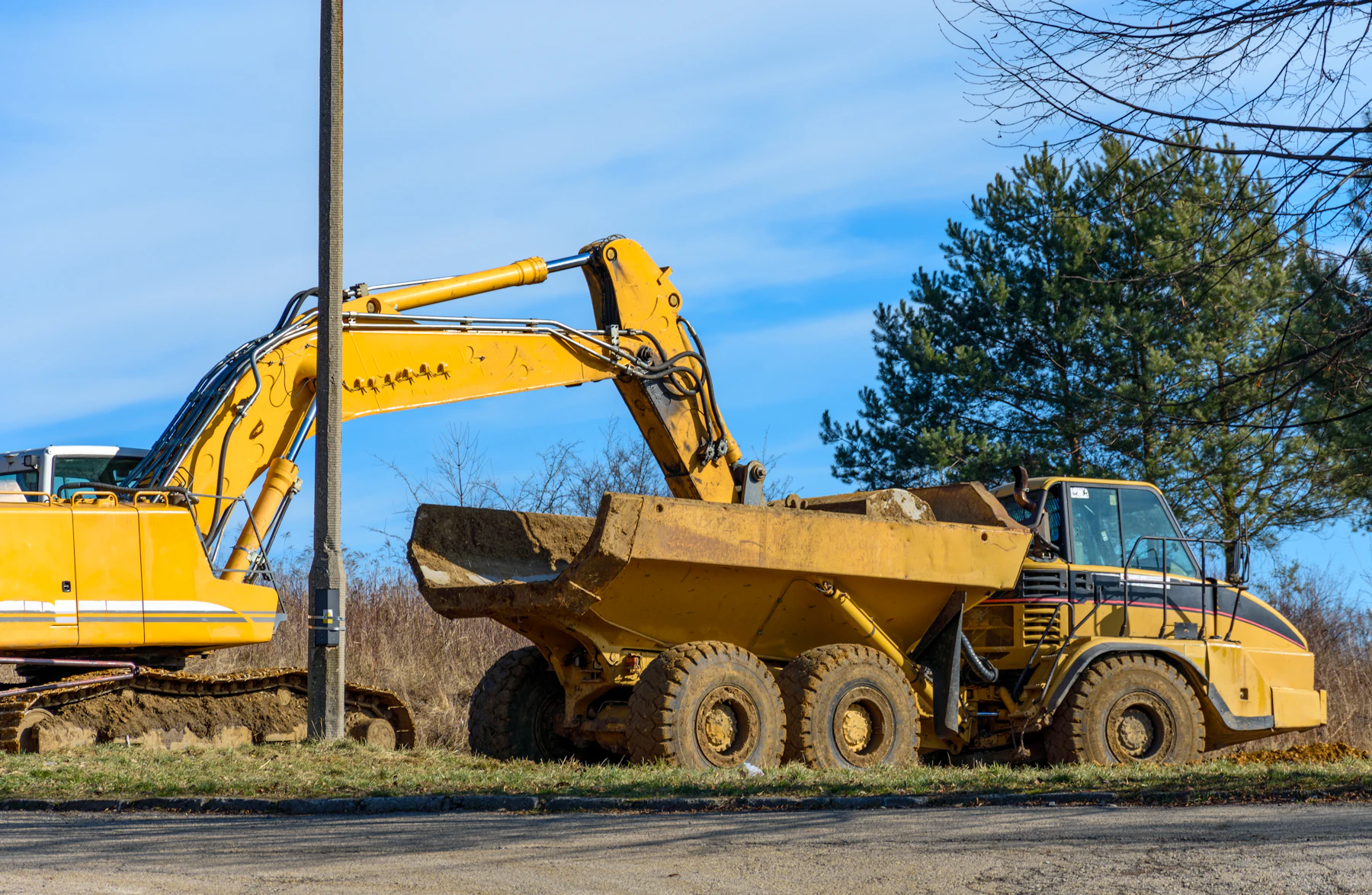 Excavator and heavy equipment performing dirt work