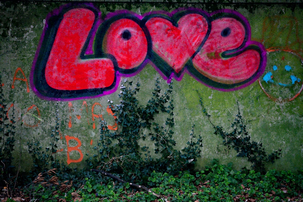 graffiti on a wall that says love