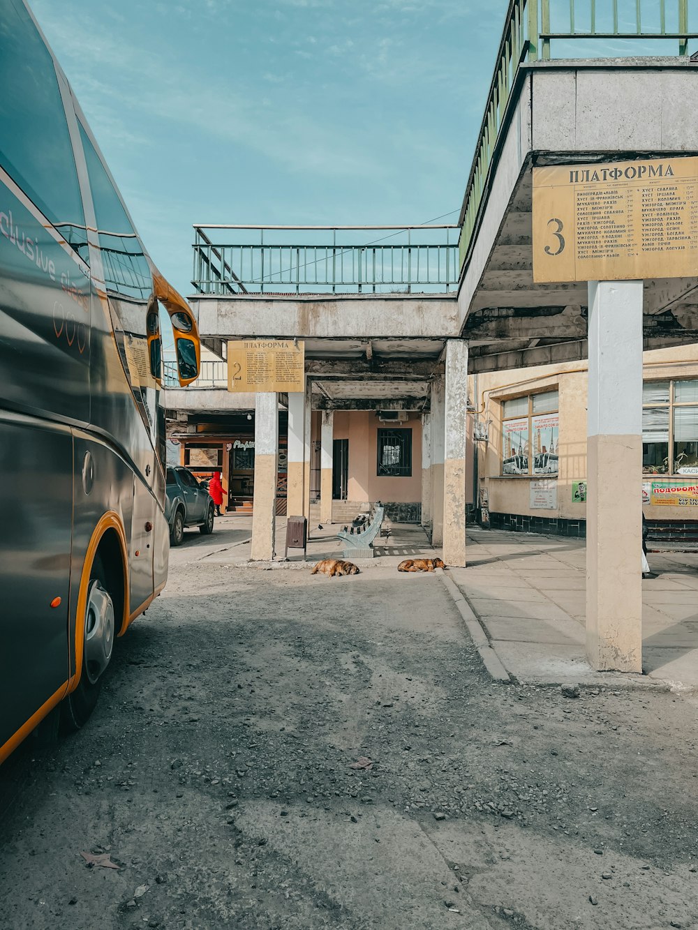 a bus parked in a parking lot next to a building