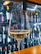 Close-up of luxury wine accessories arranged on a polished wooden table with a glass of red wine.