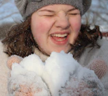 Laughter-filled moments from a winter camp with kids building a snowman.