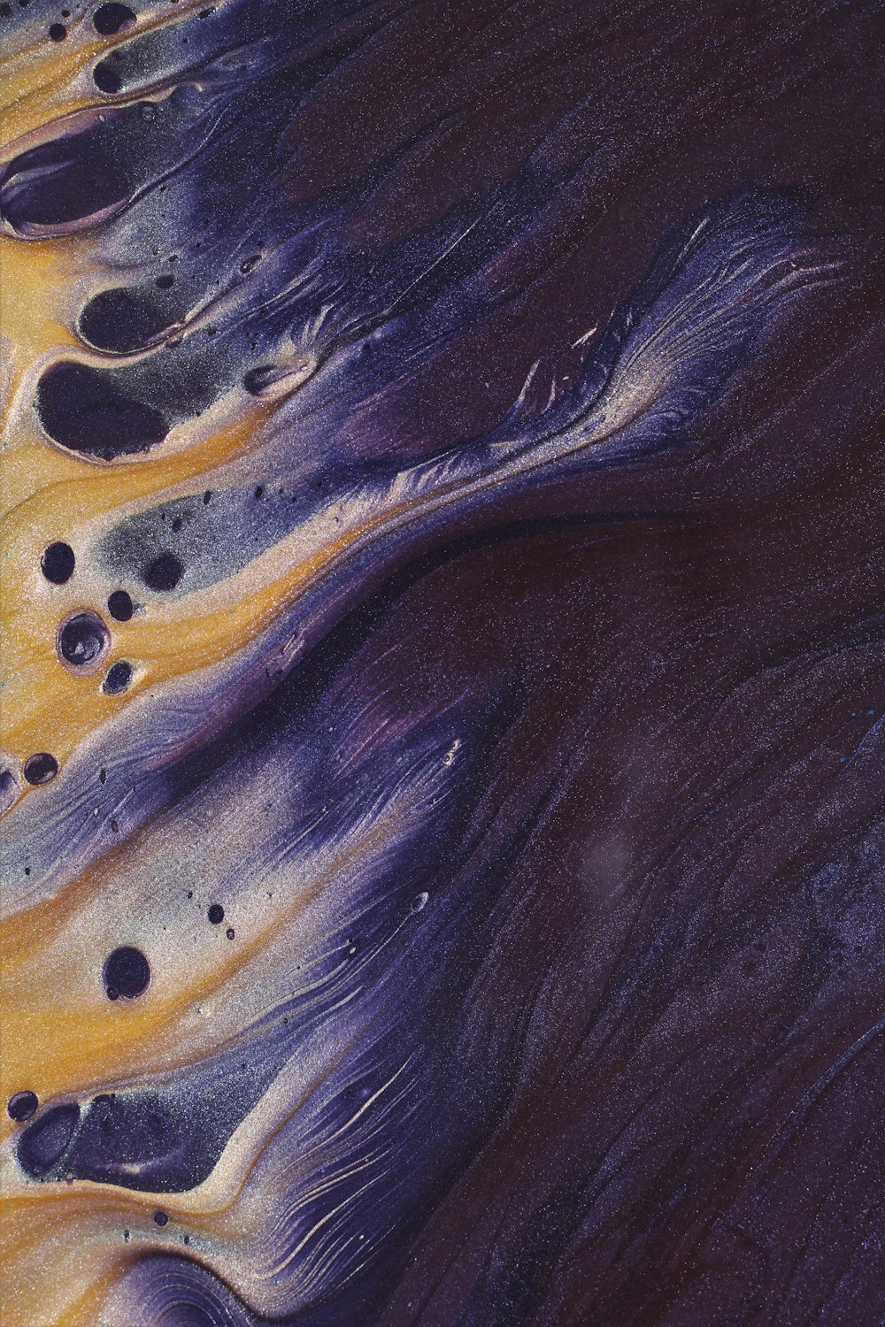 a close up of a purple and yellow substance