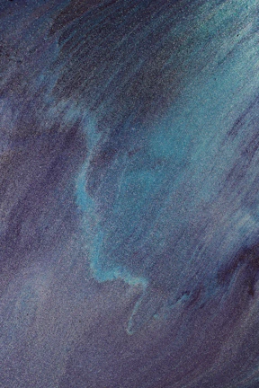 Close-up of vibrant blue and magenta waves blending softly, symbolizing energy flow