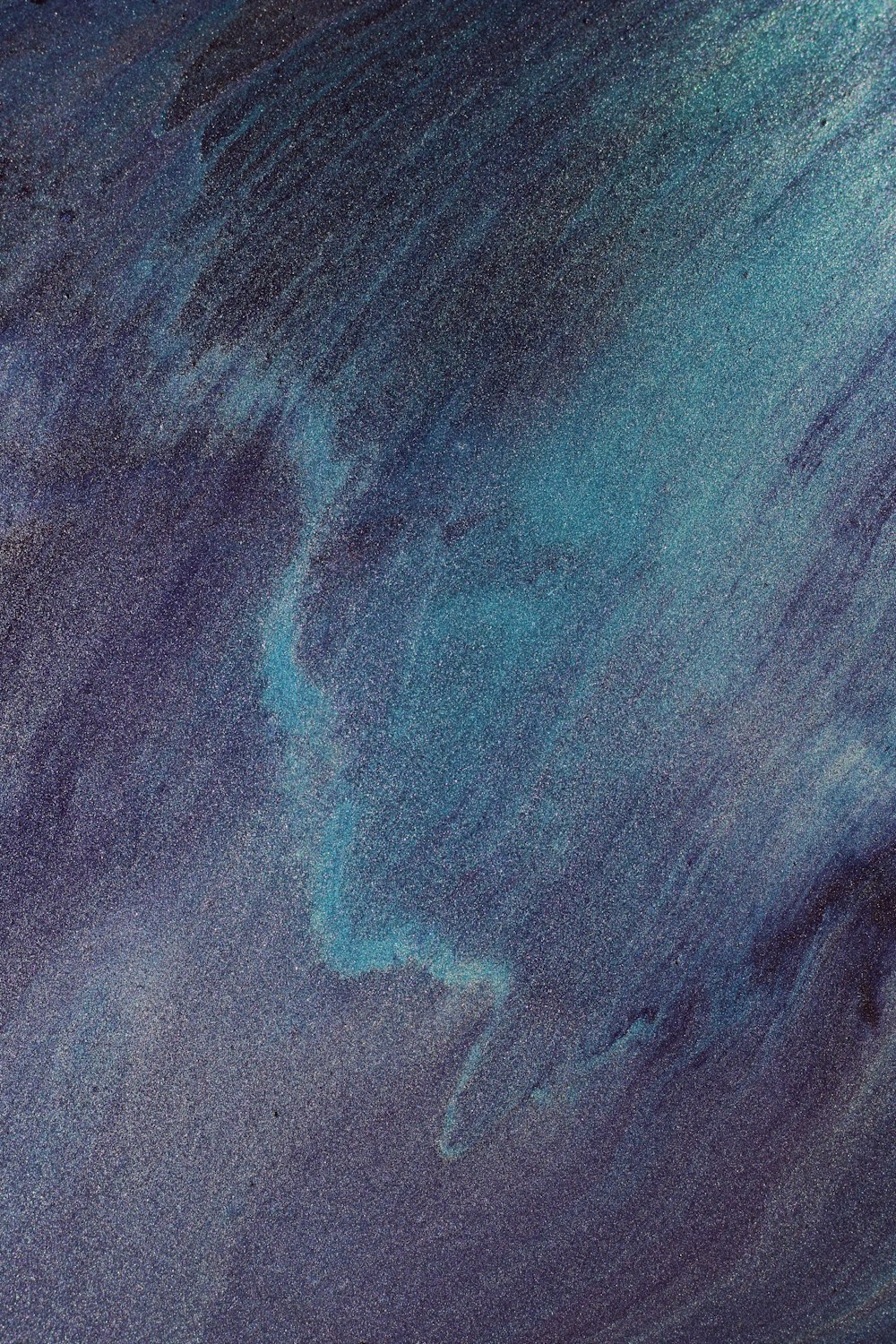 a close up of a blue and purple substance