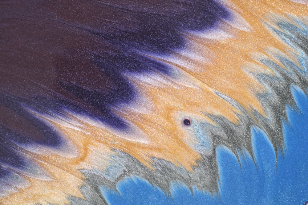 a close up of a blue and yellow tie dye pattern